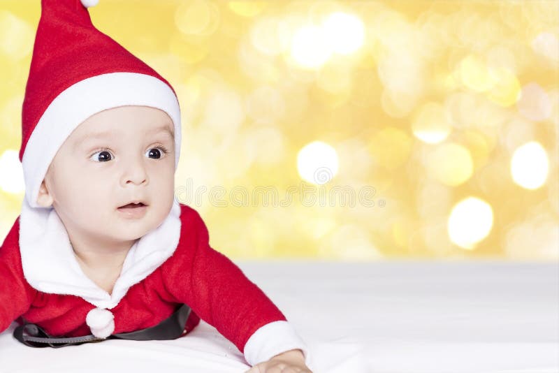 Little Santa. 6-9 months old baby boy in Santa Claus costume. Merry christmas