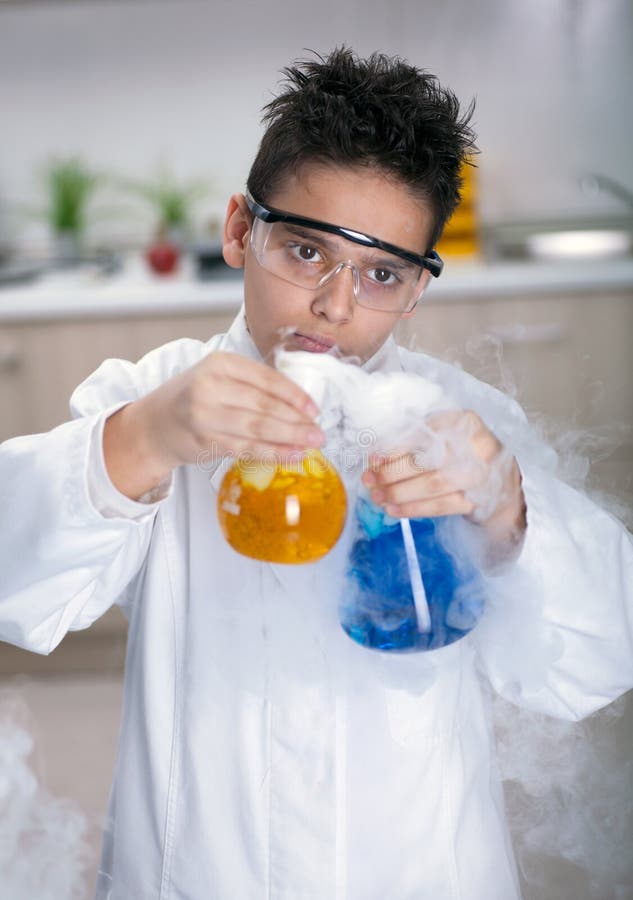 Little schoolboy working in chemistry lab. Little schoolboy working in chemistry lab