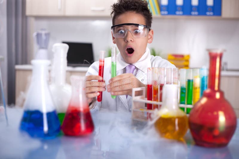 Young scientist boy working in a laboratory. Young scientist boy working in a laboratory