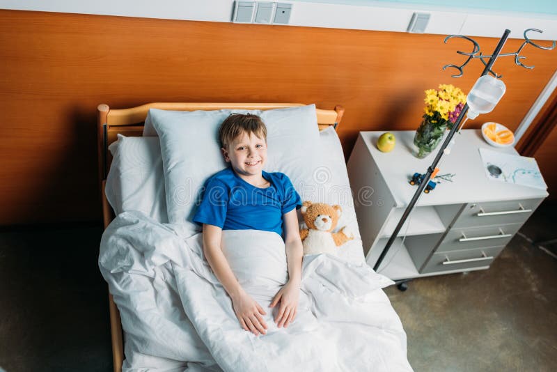 Little Smiling Boy Lying in Hospital Bed Stock Photo Image of