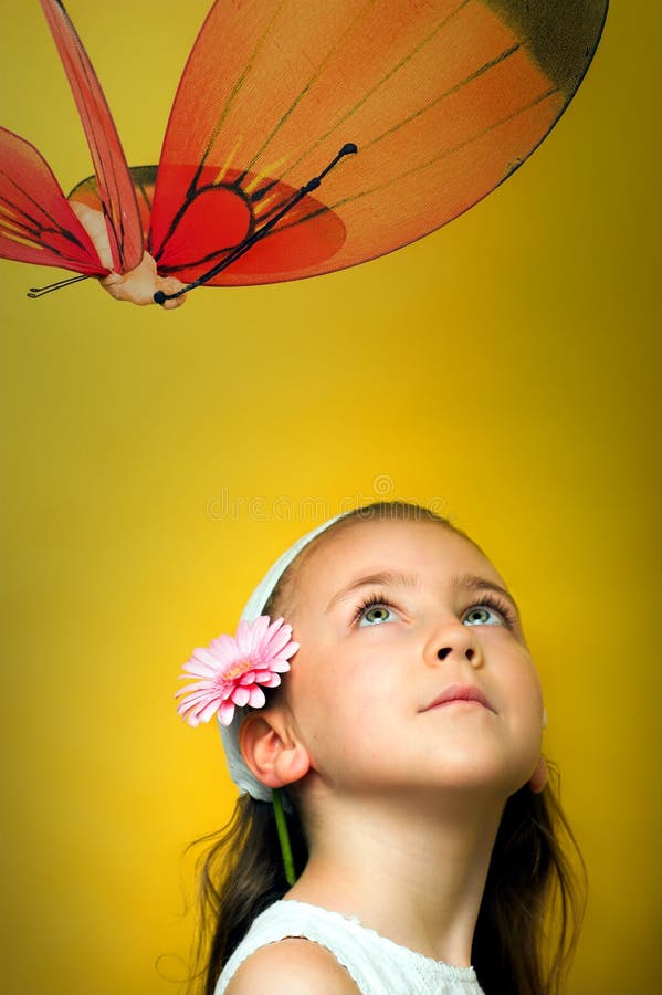 Little smiling girl with a butterfly