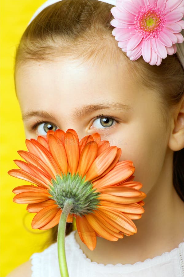 Little smiling girl with flowers