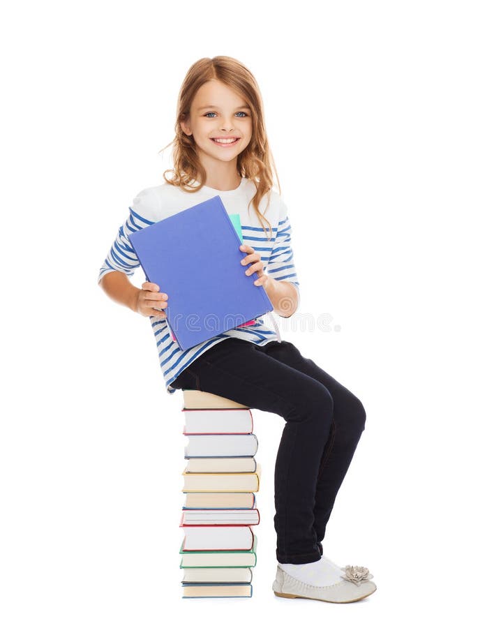 Little student girl sitting on stack of books royalty free stock photo Little student girl sitting on stack of books royalty free stock photo