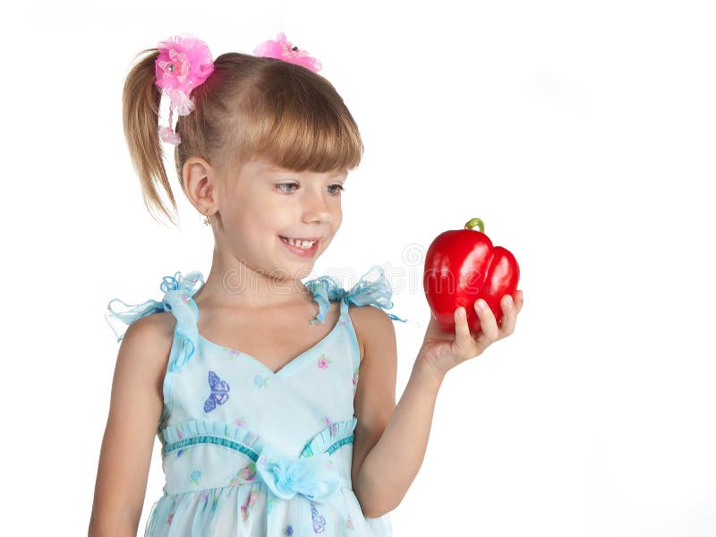 A little sweet girl with a red pepper