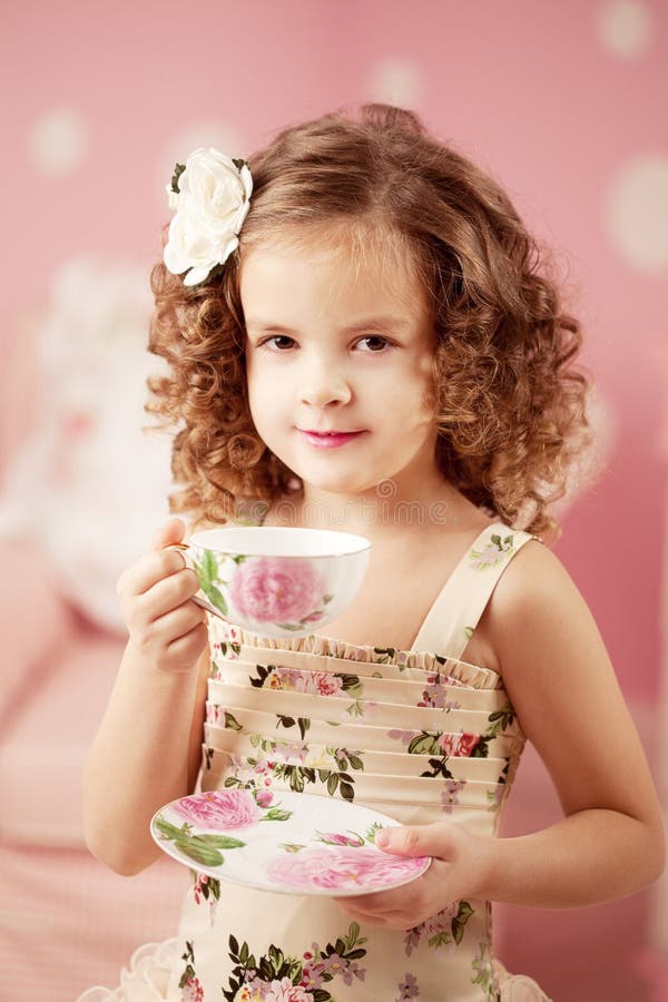 Little sweet girl with tea royalty free stock photos Little sweet girl with tea royalty free stock photos