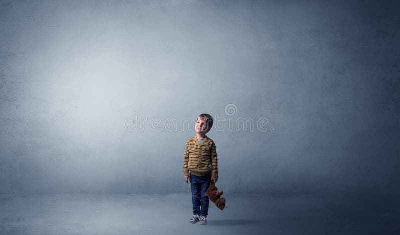 Little waggish kid in an empty room