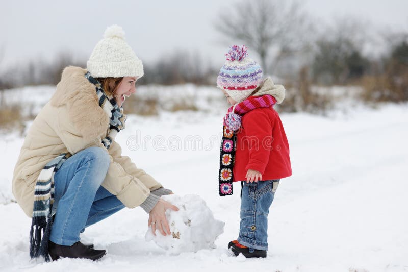 Little Winter Baby Girl and Her Young Mother Stock Image - Image of ...