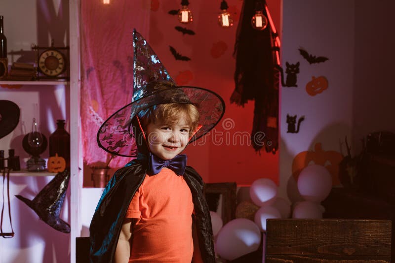 Little wizard for Halloween holiday. Happy child. Boy in wizard hat is ready for Halloween party. stock photography Little wizard for Halloween holiday. Happy child. Boy in wizard hat is ready for Halloween party. stock photography
