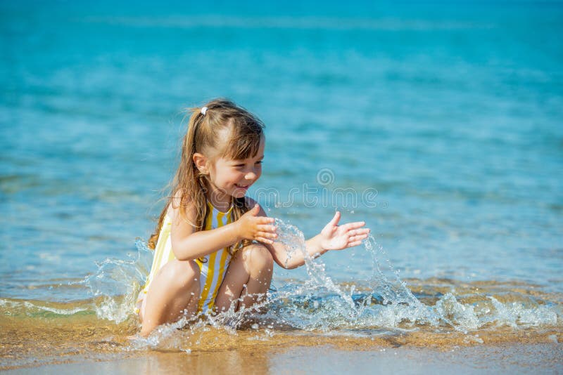 1,464 Little Girl Bathing Suit Stock Photos - Free & Royalty-Free
