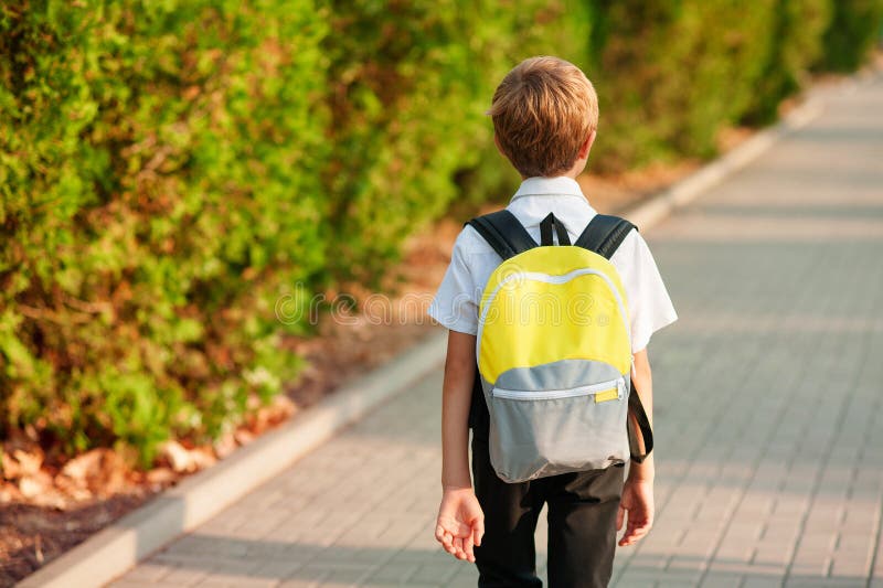 Smiling Schoolboy with School Bag Running in Sunny Day. Boy Going Home ...
