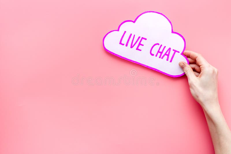 Live Chat Concept Bubble in Hands on Pink Table Top View Stock Image