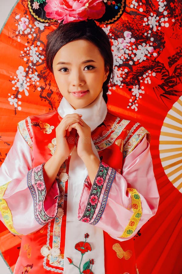Live wave Lovely Asian women wear Chinese Qing Dynasty clothes. When shooting, the model should change into ancient clothes, dress up with retro makeup and stock photography Live wave Lovely Asian women wear Chinese Qing Dynasty clothes. When shooting, the model should change into ancient clothes, dress up with retro makeup and stock photography