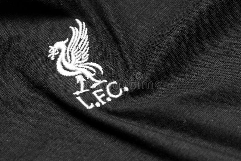 Liverpool, England-May 5,2020:Logo of the Liverpool Football Club on a black fabric Sports wear royalty free stock photos Liverpool, England-May 5,2020:Logo of the Liverpool Football Club on a black fabric Sports wear royalty free stock photos