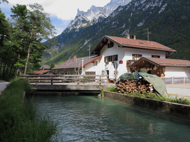 House in alpine landscape at stream idyllic domicile