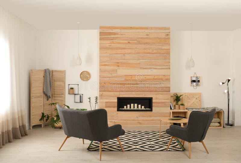 Living room interior with decorative fireplace in wooden wall