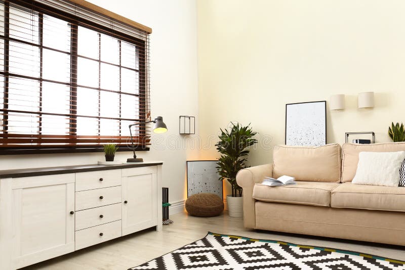 Living Room Interior with Sofa, Window Blinds and Decor Elements Stock