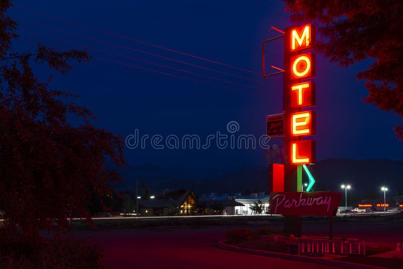 The neon sign for the Budget Host Parkway Motel, at night, in the small city of Livingstone, in the State of Montana
