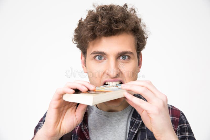 Livre acéré de jeune homme beau photographie stock libre de droits Livre acéré de jeune homme beau photographie stock libre de droits