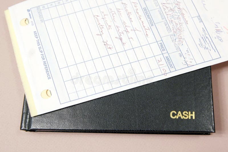 Livre et réceptions de caisse image stock Livre et réceptions de caisse image stock