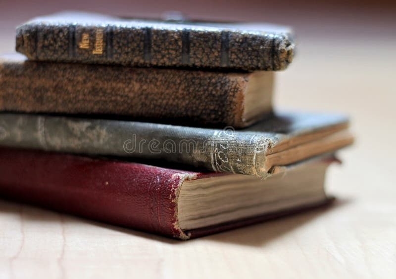 Stack of dusty worn books on poetry and and a bible. Stack of dusty worn books on poetry and and a bible