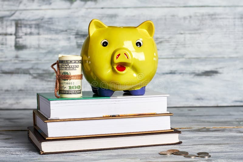 Books, dollars and piggy box. How to acquire knowledge. Books, dollars and piggy box. How to acquire knowledge.
