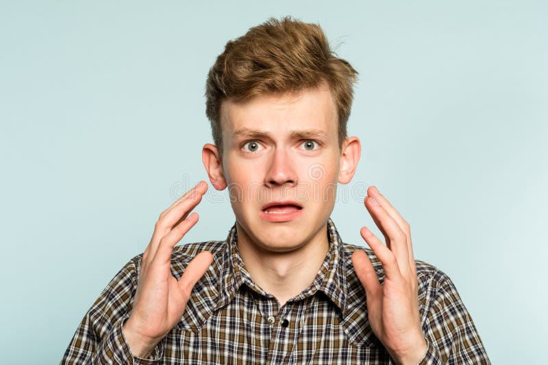 Oh no. terrified shocked desperate alarmed dismayed man in distress. portrait of a young guy on light background. emotion facial expression. feelings and people reaction concept. Oh no. terrified shocked desperate alarmed dismayed man in distress. portrait of a young guy on light background. emotion facial expression. feelings and people reaction concept.