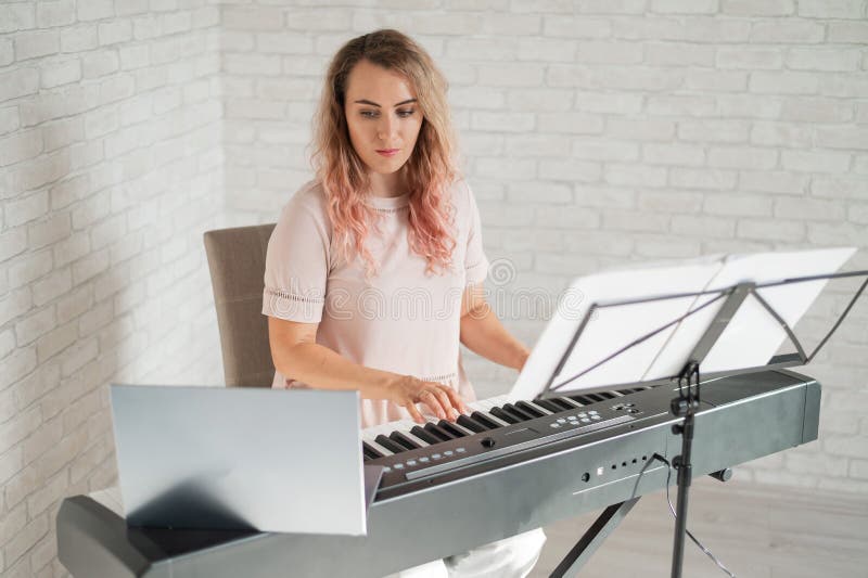 Remote music lessons. A singing teacher records the lesson on a laptop webcam. Remote music lessons. A singing teacher records the lesson on a laptop webcam
