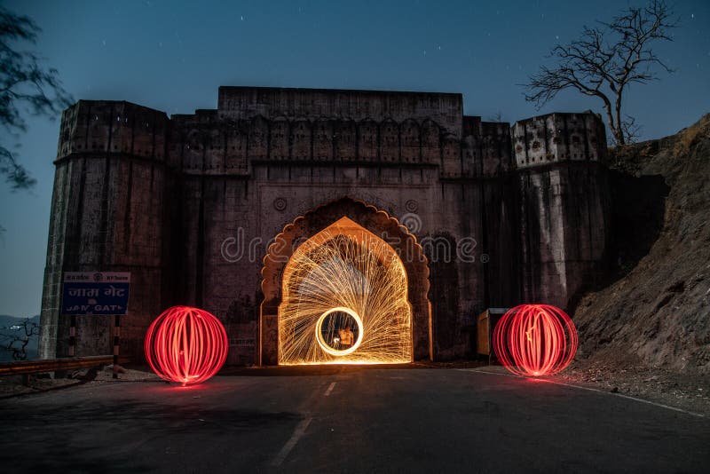 The Jam Gate is a picnic spot in Maheshwar Tehsil of Khargone district[1] in the state of Madhya Pradesh, India.[2][3][4] It is on Mhow-Mandleshwar Road Now Khargone - Indore state highway no.1. It is approximately 30 km from Mhow, 50 km from Indore, 33 km from Maheshwar and 75 km from district headquarter Khargone. Jam gate is the gateway of Malwa - Nimar.
Light Painting 
Long exposure techniques enable photographers to create unique effects that aren’t possible at standard or high shutter speeds. One example of this is light painting.
Sometimes called light drawing or light graffiti, light painting is the photographic technique of using a moving light source—such as a flashlight, glow stick, light brush, or even a smartphone—to alter an image while taking a long exposure photograph. Instead of just capturing an image as-is, light painters add another element by highlighting an object or creating streaks, colors, or flashes within the image. The Jam Gate is a picnic spot in Maheshwar Tehsil of Khargone district[1] in the state of Madhya Pradesh, India.[2][3][4] It is on Mhow-Mandleshwar Road Now Khargone - Indore state highway no.1. It is approximately 30 km from Mhow, 50 km from Indore, 33 km from Maheshwar and 75 km from district headquarter Khargone. Jam gate is the gateway of Malwa - Nimar.
Light Painting 
Long exposure techniques enable photographers to create unique effects that aren’t possible at standard or high shutter speeds. One example of this is light painting.
Sometimes called light drawing or light graffiti, light painting is the photographic technique of using a moving light source—such as a flashlight, glow stick, light brush, or even a smartphone—to alter an image while taking a long exposure photograph. Instead of just capturing an image as-is, light painters add another element by highlighting an object or creating streaks, colors, or flashes within the image.