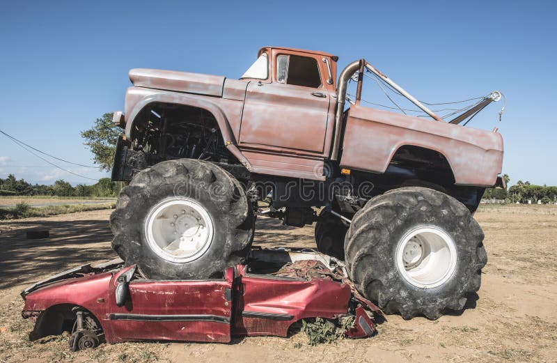 Monster truck over cars. Blue sky. Monster truck over cars. Blue sky