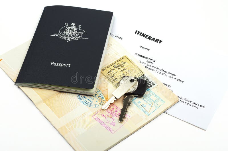 Passport with holiday itinerary immigration stamps and car keys. Passport with holiday itinerary immigration stamps and car keys