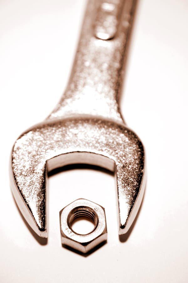 Closeup of chrome spanner and nut. Closeup of chrome spanner and nut