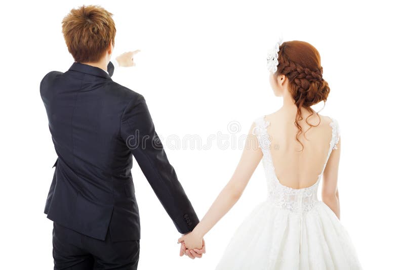 llevando a cabo las manos novia y novio aislados en blanco imagen de archivo libre de regalías llevando a cabo las manos novia y novio aislados en blanco imagen de archivo libre de regalías