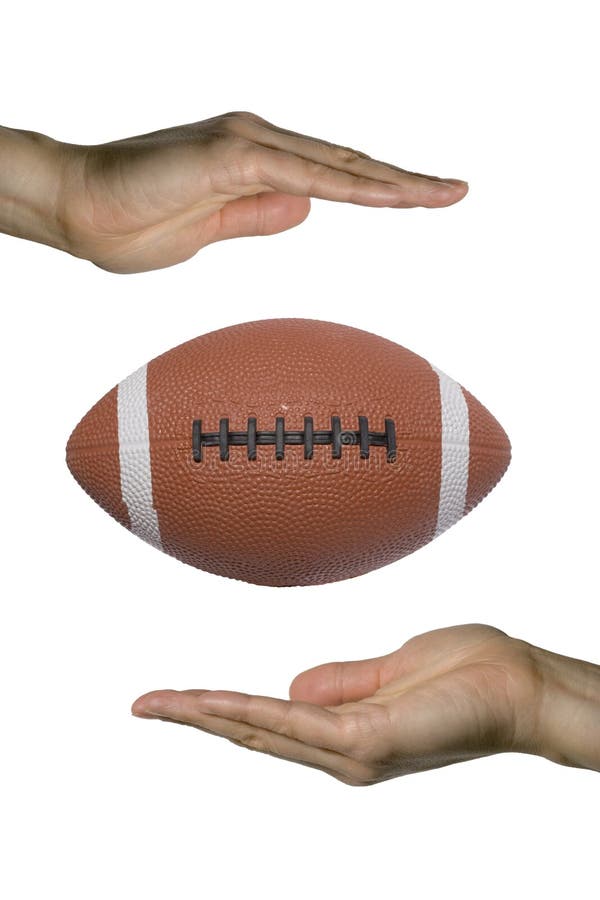 Two hands holding a football (vertical). Two hands holding a football (vertical)