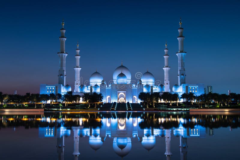 Sheikh Zayed Grand Mosque reflected on the water in Abu Dhabi emirate of United Arab Emirates at blue hour. Sheikh Zayed Grand Mosque reflected on the water in Abu Dhabi emirate of United Arab Emirates at blue hour