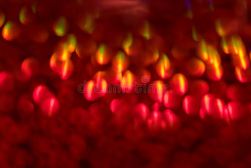 Lo scintillio rosso Defocused accende il fondo Natale vago di Bokeh fotografia stock Lo scintillio rosso Defocused accende il fondo Natale vago di Bokeh fotografia stock