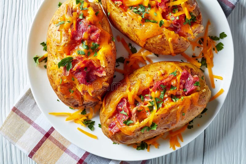 Loaded Baked Potatoes with Bacon, Cheese, Meat Stock Photo - Image of