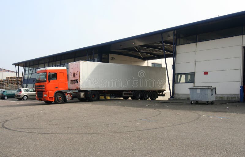 Loaded Truck leaving Factory stock images