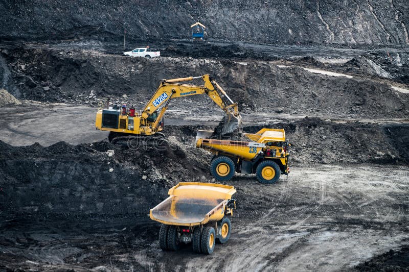 Loading coal into body truck. Mining truck mining machinery,to transport coal. royalty free stock photography
