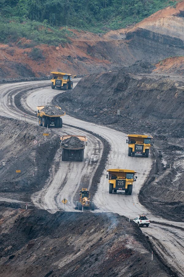 Loading coal into body truck. Mining truck mining machinery,to transport coal. Indonesia coal mining. royalty free stock photos