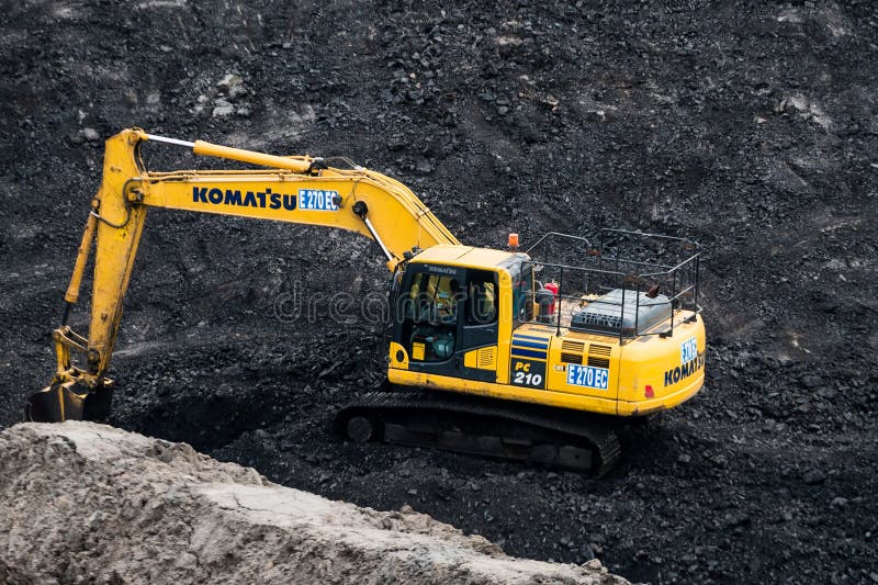 Loading coal into body truck. Mining truck mining machinery,to transport coal. stock photography