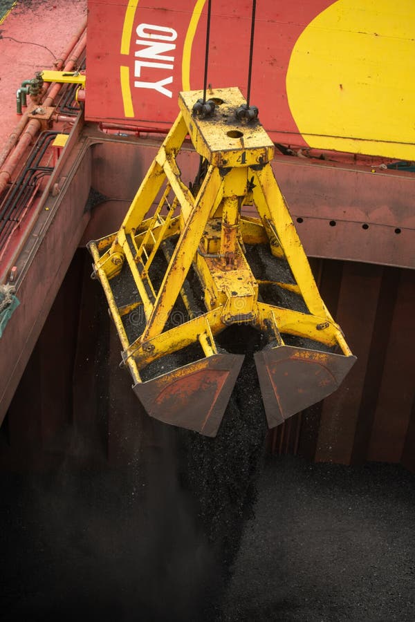 Loading Coal from Cargo Barges Onto a Bulk Vessel Using Ship Cranes in