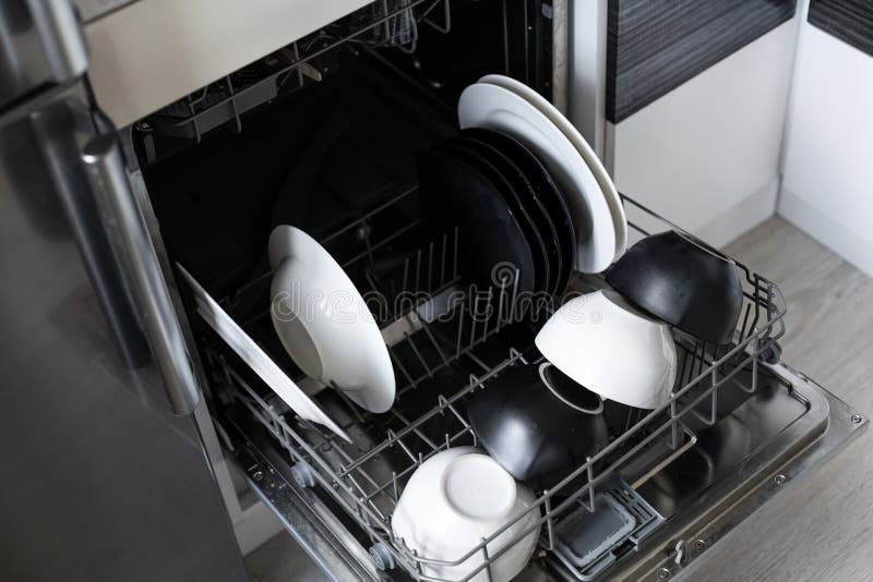 Loading Dirty Dishes in the Dishwasher. Close Up Stock Image Image of