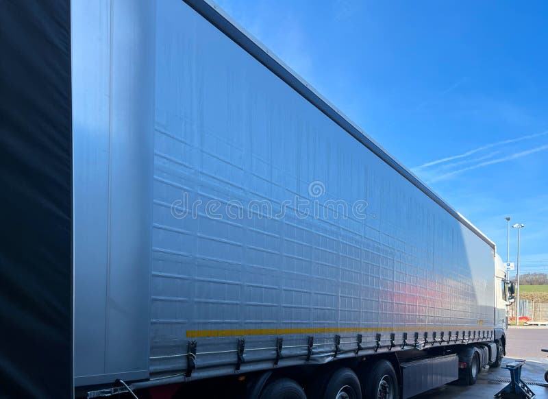 Loading or Unloading Cargo in a Tractor Trailer on a Ramp Stock Photo