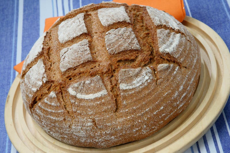 Loaf of rye bread on plate stock photo. Image of bake 6971504
