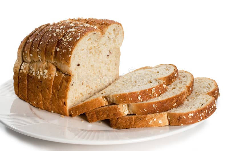 Loaf of sliced bread on plate. Isolated on white.