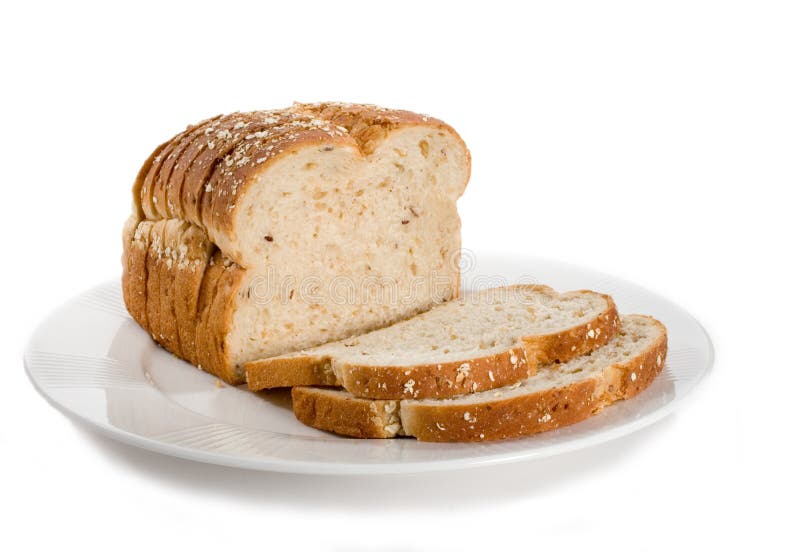 Loaf of sliced bread on plate. Isolated on white.