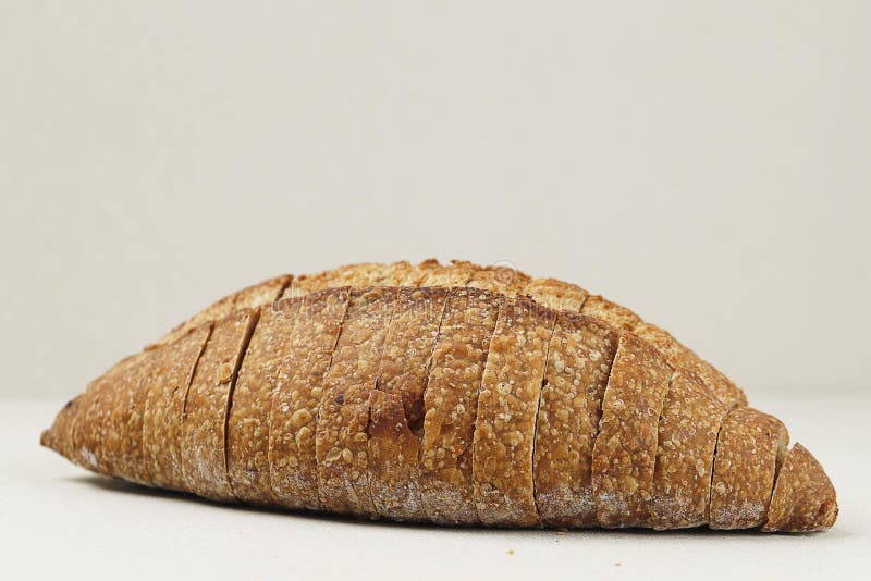 Loaf Whole Wheat Sourdough Bread on Cream Background Stock Image