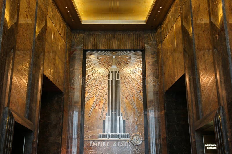 NEW YORK, USA - JULY 4, 2013: Empire State Building lobby in New York. The art-deco style 381m tall office building was the tallest building in the world for 40 years. NEW YORK, USA - JULY 4, 2013: Empire State Building lobby in New York. The art-deco style 381m tall office building was the tallest building in the world for 40 years