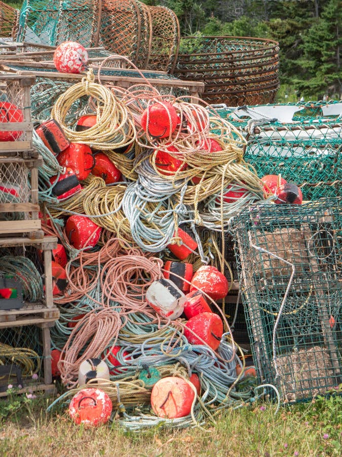 Set Of Blue Fishing Nets And Ropes Of Different Sizes On A Pier In