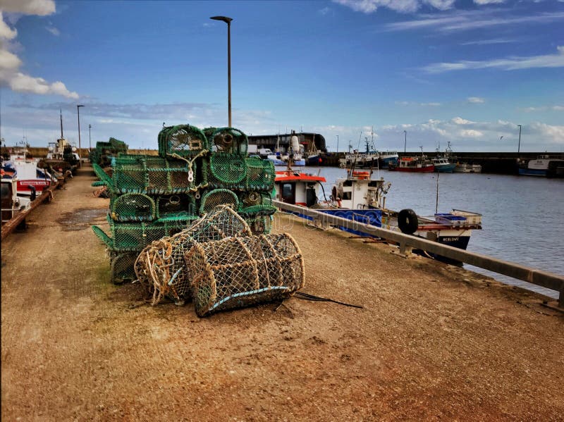 Lobster Pots on the quay stock image. Image of netting 218310055